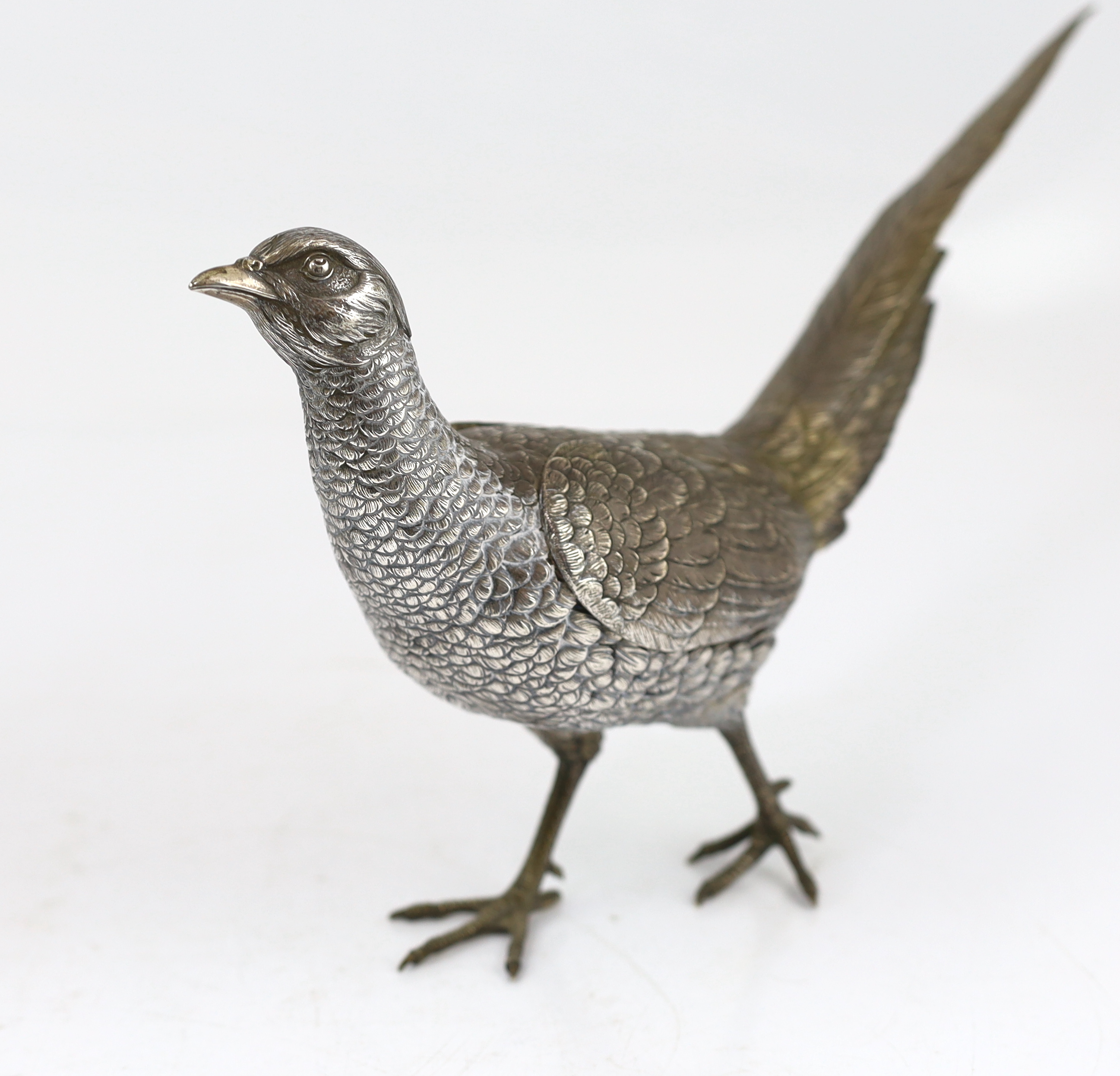 A large pair of German 800 standard silver free standing model pheasants with articulated wings, c.1930, 46cm long